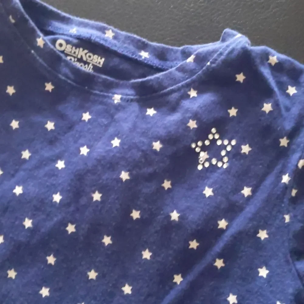 Girls blue tshirt with white stars size 8.